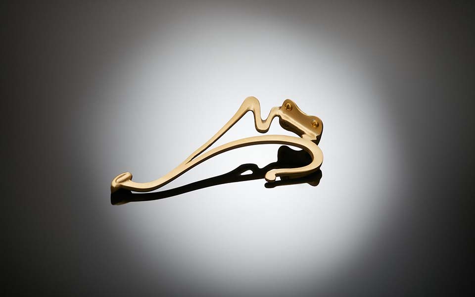 polished brass door hook/ Victor Horta