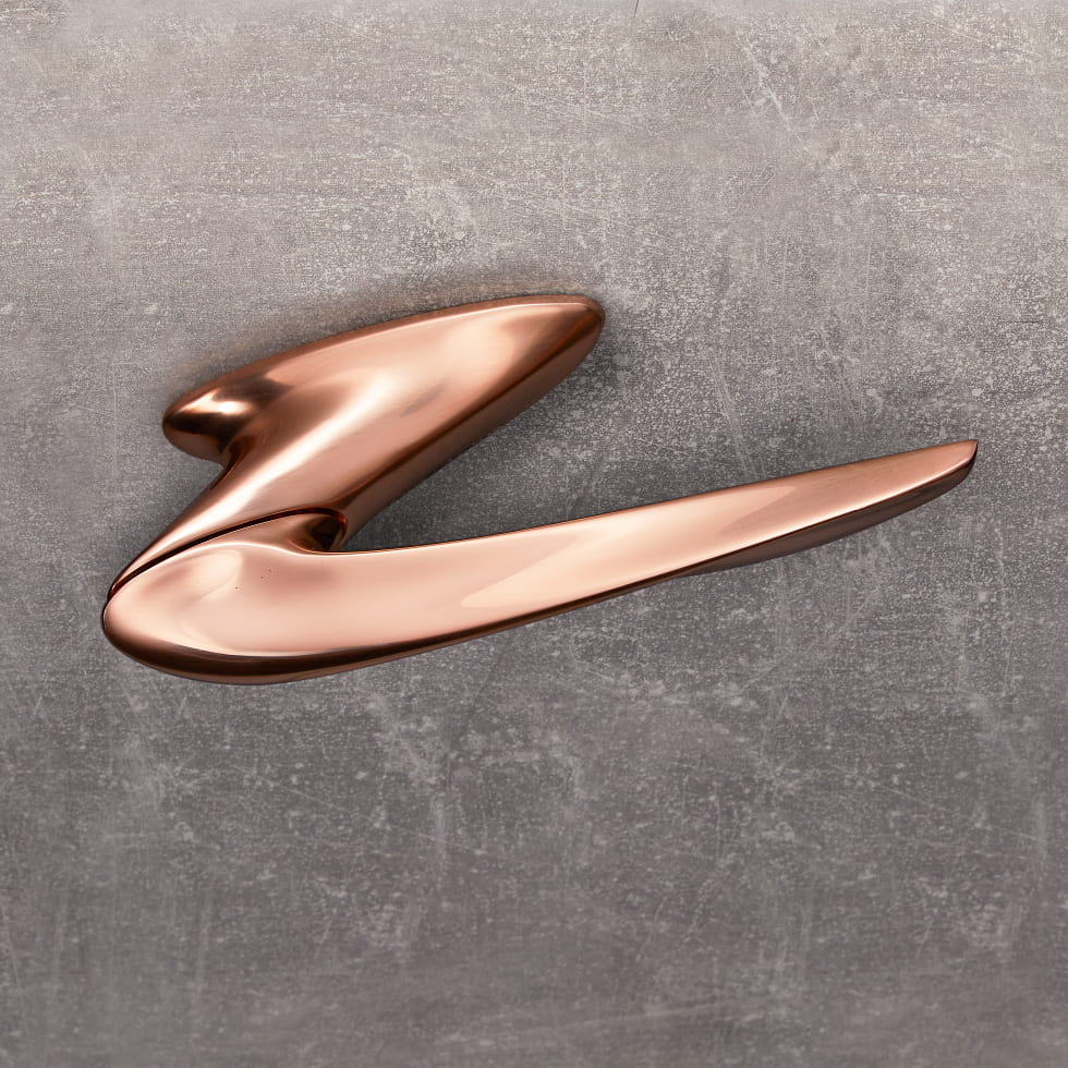 Nexxa door handle by Zaha Hadid and by izé in rose gold finish.